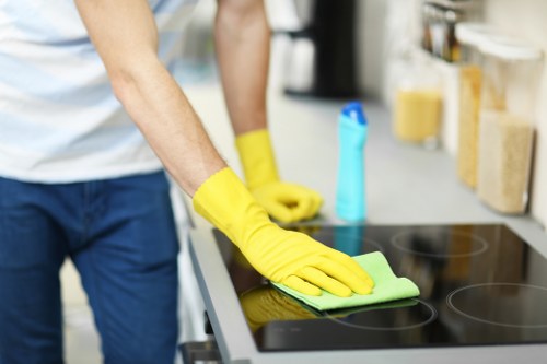 Professional cleaner preparing a short-term rental living room