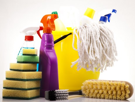 Vacuuming a couch for routine sofa cleaning